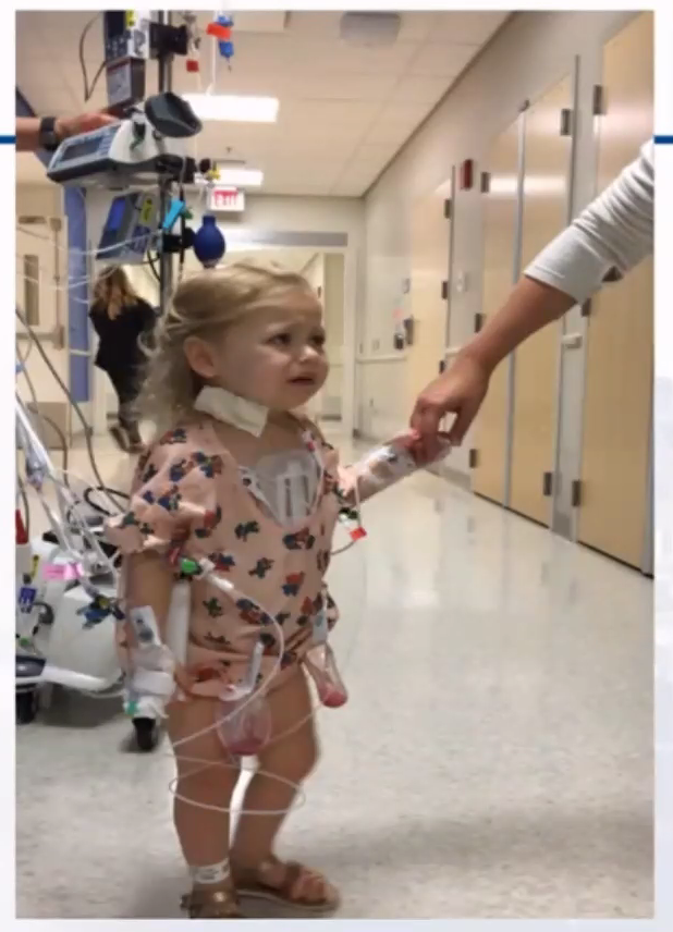 SapnaKmd's tweet photo. Hard for 2-year-old to get hyped about going for a walk POD #1 w/fresh sternotomy wound, arterial line,  2 chest bulbs to suction, IJ line &amp; tethered to an IV pole. 

Easier to get excited in a cozy coupe car. Whose idea? FAMILY. #ICURehab #PedsCICU #PedsICU

#ConsentObtained https://t.co/WglrN0PJ7F