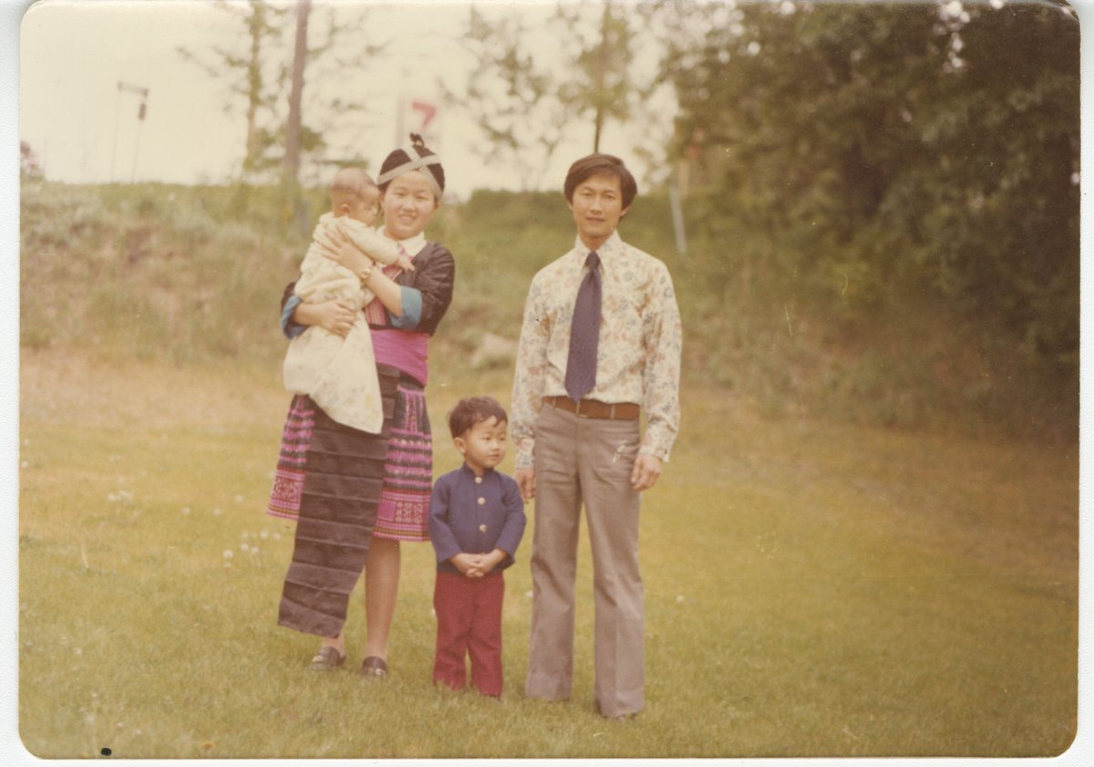 #OTD: 1975 Dang Her and his wife Shoua Moua become the first Hmong family to settle in Minnesota. Dang worked for USAID during the Secret War in Laos qualifying him for asylum. Read more with MNopedia: bit.ly/3kV2ldK Photo: courtesy Her family, taken in 1977 in Anoka.