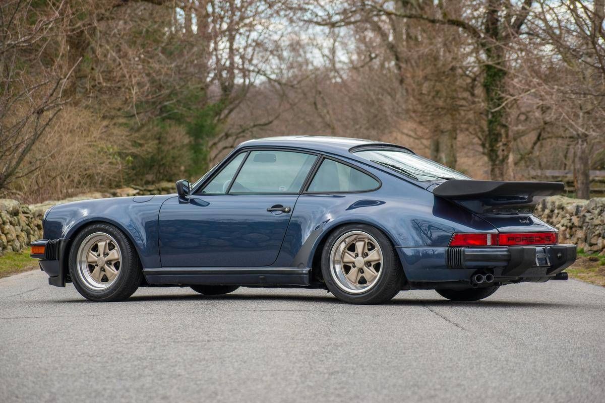 PorscheMarket's tweet photo. This 1986 #Porsche 930 Turbo Coupe was special ordered and finished in the rare Prussian Blue with a Dark Blue full leather interior. It only has 20k miles and is of course equipped with a manual transmission. #Classifind

▶️ https://t.co/uhnav33NIp https://t.co/wmECnFW7cD