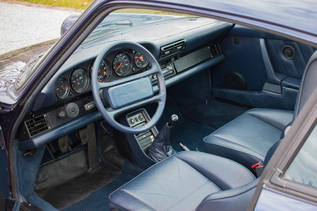 PorscheMarket's tweet photo. This 1986 #Porsche 930 Turbo Coupe was special ordered and finished in the rare Prussian Blue with a Dark Blue full leather interior. It only has 20k miles and is of course equipped with a manual transmission. #Classifind

▶️ https://t.co/uhnav33NIp https://t.co/wmECnFW7cD