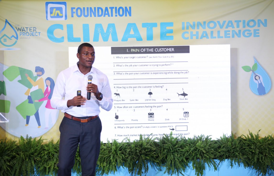 CaribbeanCIC's tweet photo. Carlinton Burrell, CEO of the Caribbean Climate Innovation Center speaks at the opening of the Jamaica National Foundation Bootcamp and did a very vibrant presentation on the Big Idea Canvas. #JNFClimateChallenge #ClimateAction #JNFoundation https://t.co/QZY5AJcWN1