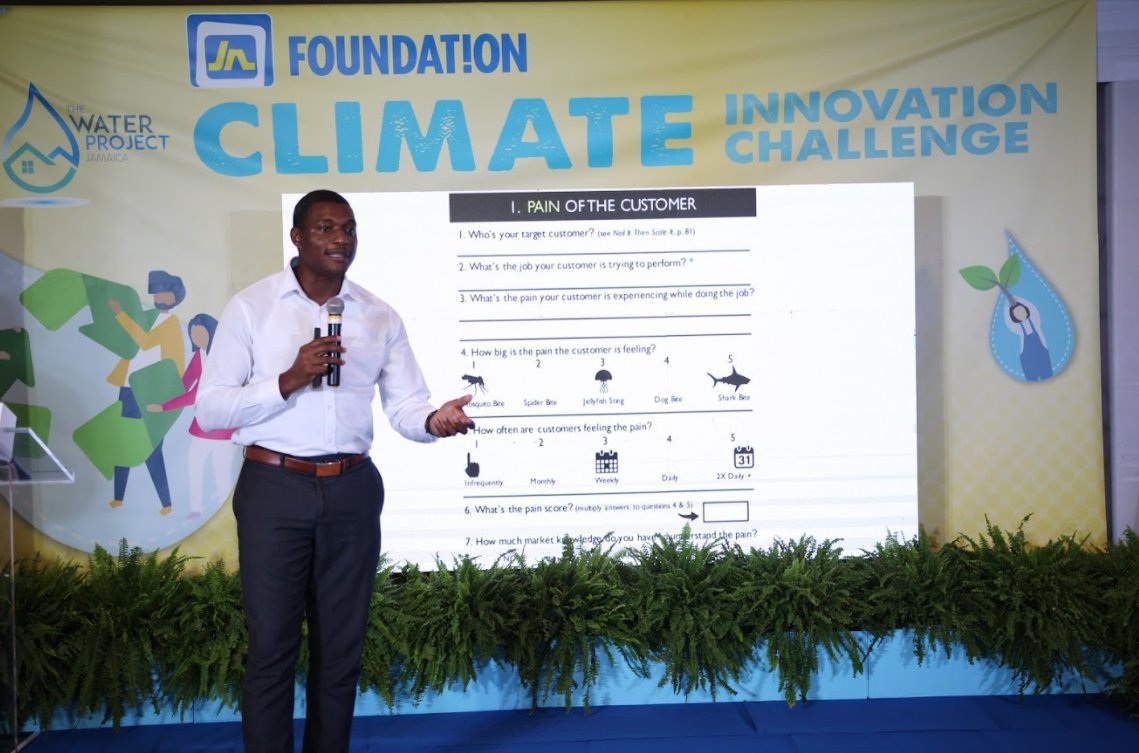 CaribbeanCIC's tweet photo. Carlinton Burrell, CEO of the Caribbean Climate Innovation Center speaks at the opening of the Jamaica National Foundation Bootcamp and did a very vibrant presentation on the Big Idea Canvas. #JNFClimateChallenge #ClimateAction #JNFoundation https://t.co/QZY5AJcWN1