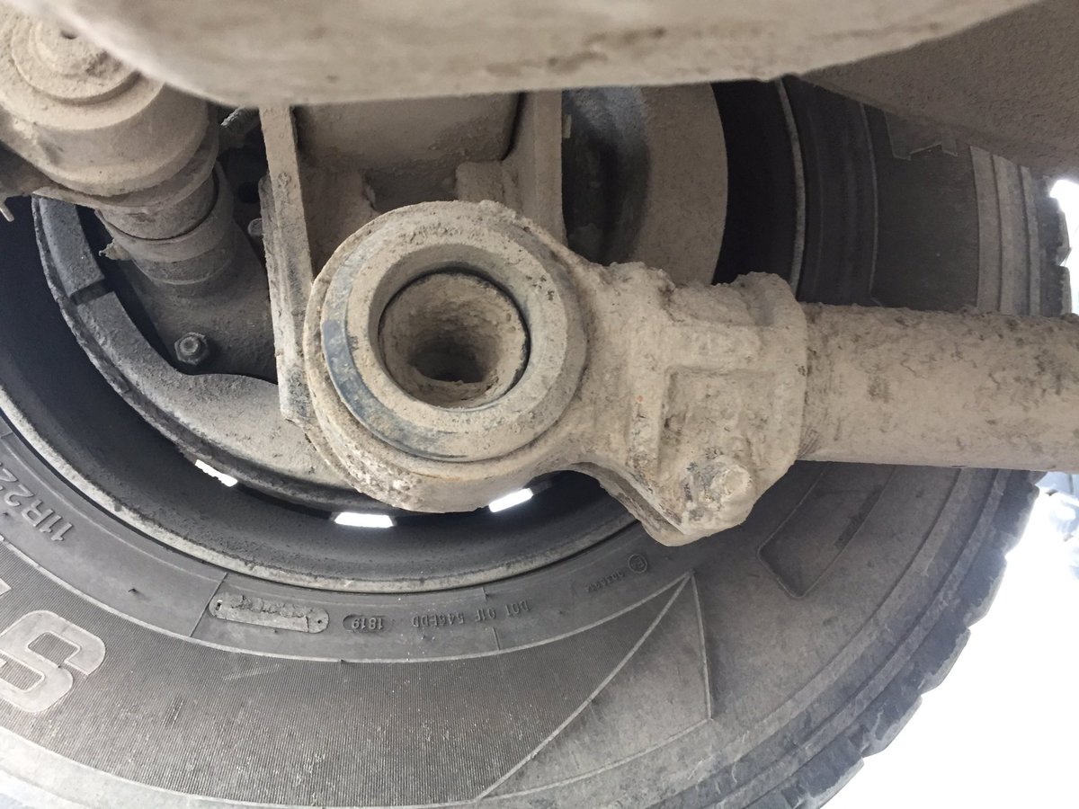 HRPSCMV's tweet photo. Investigating complaint about stones on the road witnessed this load overflowing the box and shredded load covering @HRPSMiltHH. CVSA level 1 inspection found missing suspension component... again, and improper inspection. Not #RoadSafety. Charged and out of service. ^CB https://t.co/Dp9u59SDJG