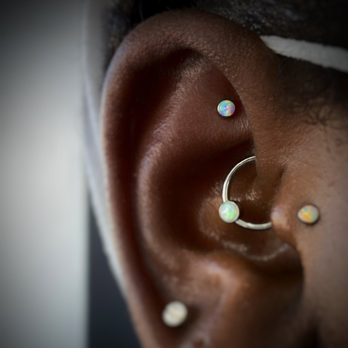ECWJAX's tweet photo. Fresh Faux Rook by Nana Shakti next to a healed Daith piercing by James Coleman. #ECWJax #NanaPiercer #SafePiercing #JacksonvillePiercing #CuratedEar #EarProject #EarCuration #Neometal #Anatometal #Titanium #BodyPiercing #JacksonvillePiercing #FloridaPiercing https://t.co/q5EmNs8Nag