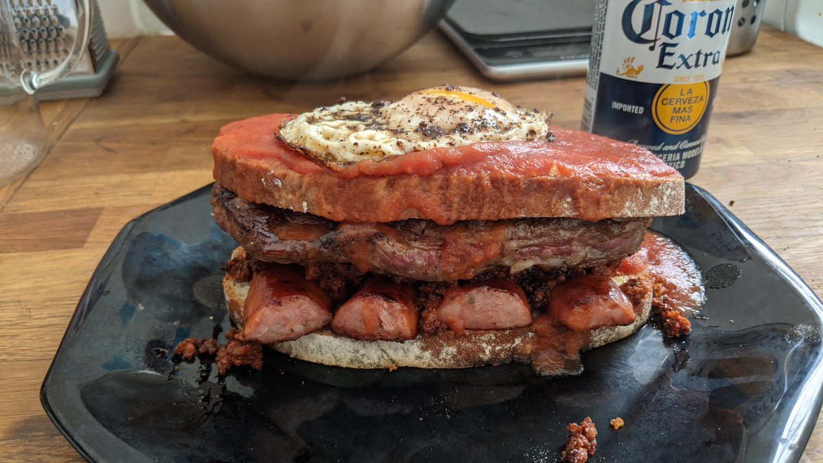 Take a break from watching Nevada and try your hand at francesinha, a Portuguese meat sandwich. 1800 calories of chorizo, andouille sausage, sirloin steak, covered with melted cheese, tomato beer sauce, and topped with a fried egg. #francesinha #Sandwich 

dinnerbydennis.com/francesinha/