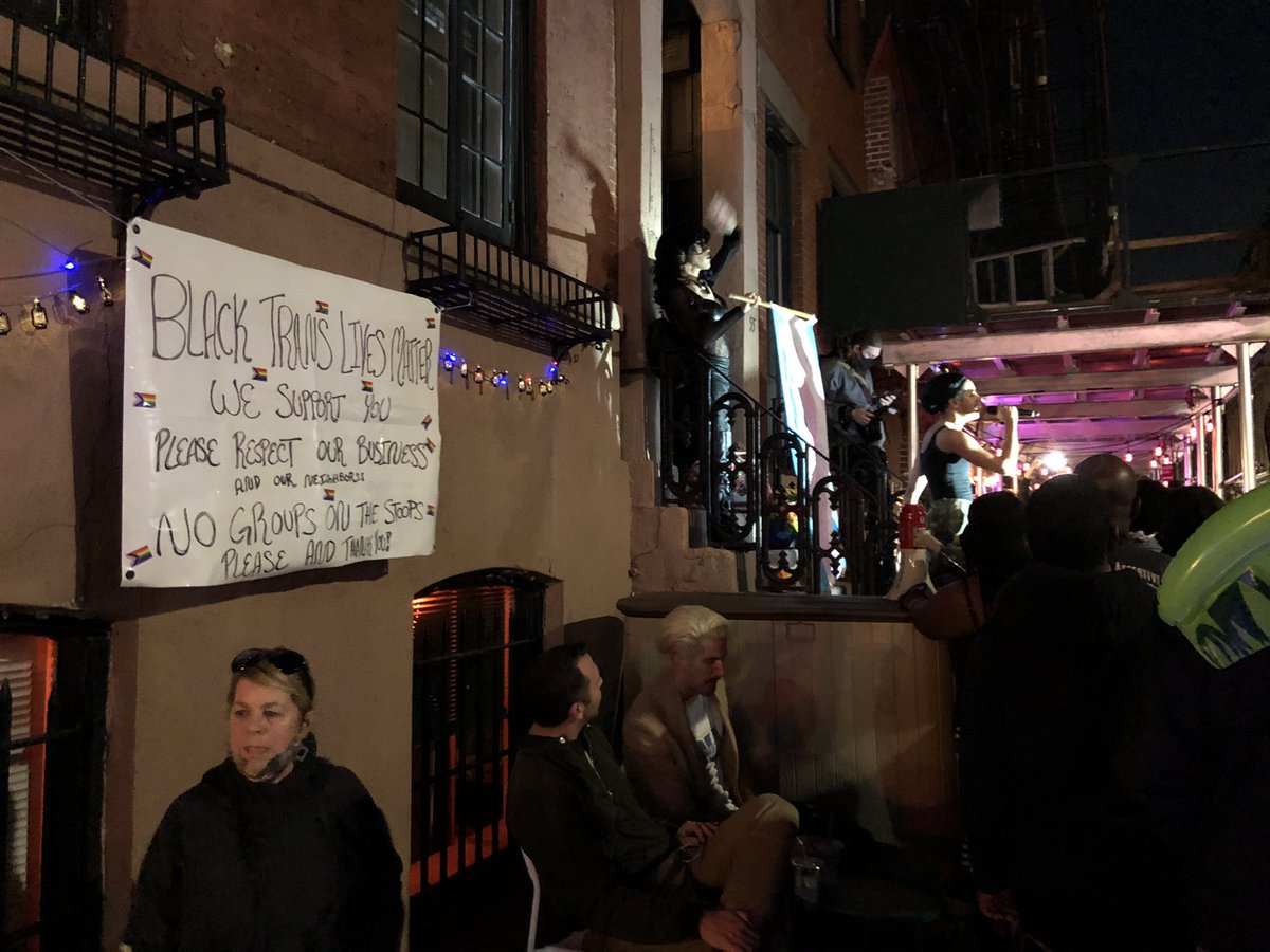 On one side of the street Black Trans activists sing You’ll Never Walk Alone. Across from them hundreds of NYPD officers on Mtn Bikes and riot gear standby.