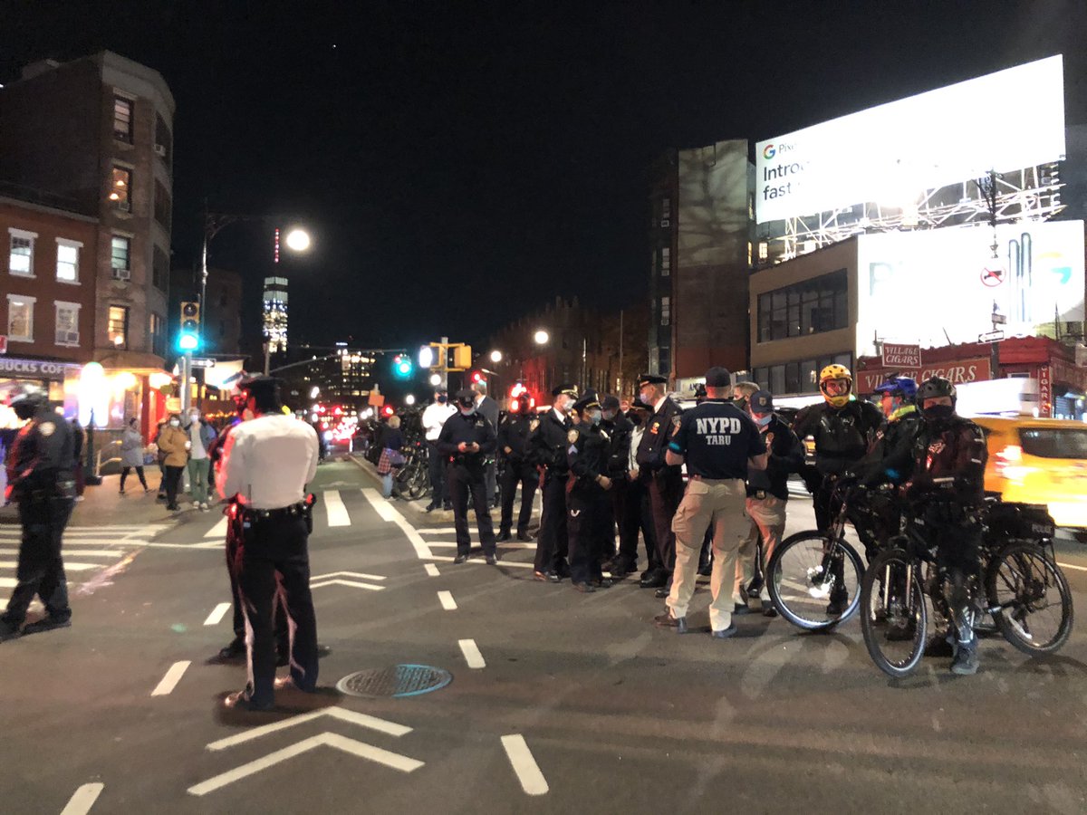 NYPD on streets. Helicopters overhead.