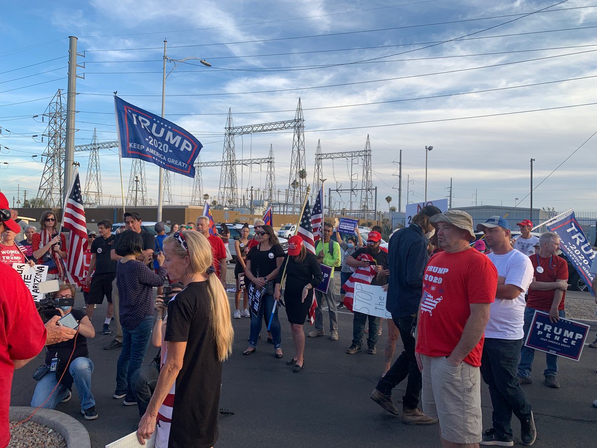 Everybody is standing in a semicircle around this guy’s cell phone. Cheers when Trump says he’s on track to win Arizona.