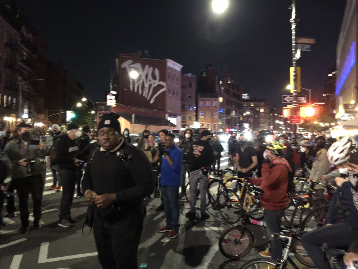 Protester ask press to keep 15 feet from them, especially “aggressive photographers.” Otherwise, “you’ll be asked to leave.” Many scoffs from press corps.