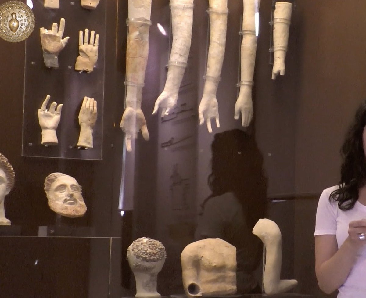 Votives would be made in the form of terracotta body parts, creating the part of the body that required healing. As Gizas shows, the arms or legs, chests or heads would be hung from the ceiling, like this arm was from the metal hook, or stacked on shelves.