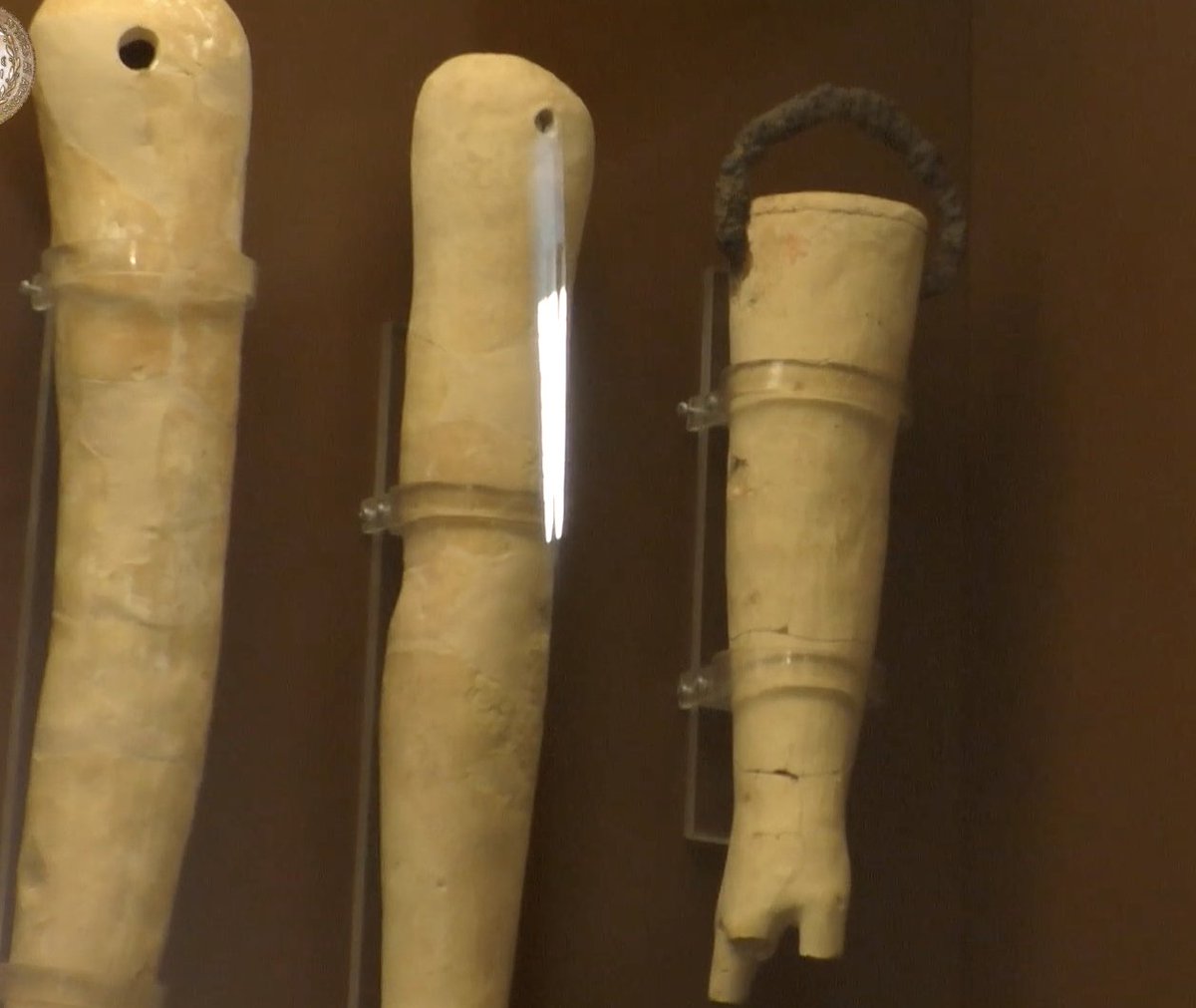 Votives would be made in the form of terracotta body parts, creating the part of the body that required healing. As Gizas shows, the arms or legs, chests or heads would be hung from the ceiling, like this arm was from the metal hook, or stacked on shelves.