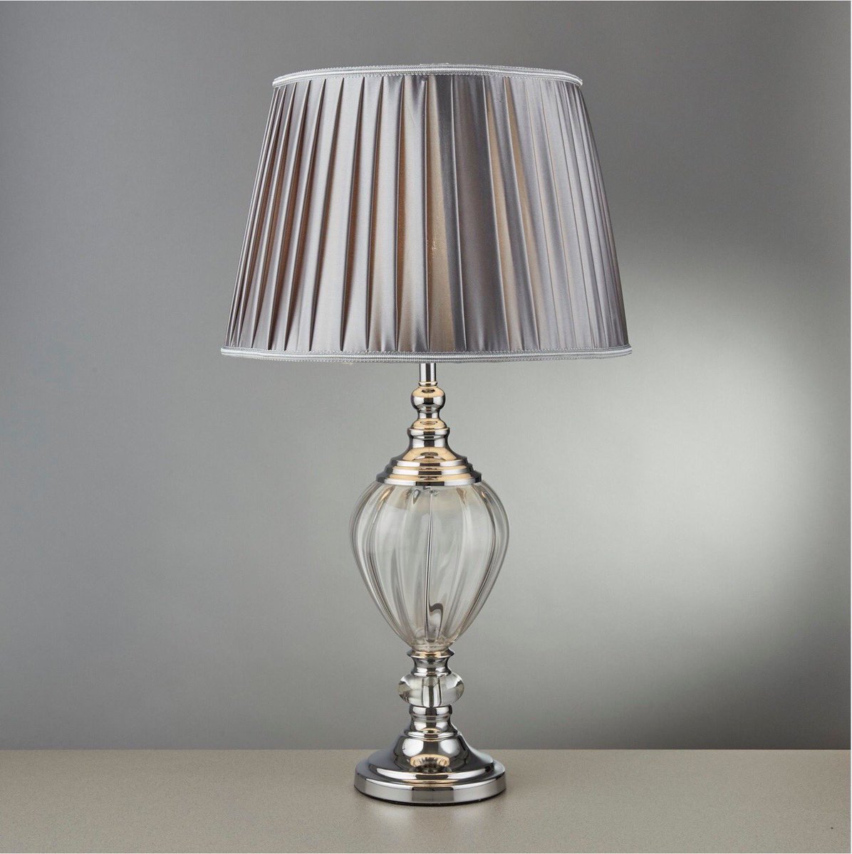 sczes's tweet photo. Make an impact in your living room, bedroom or study with this stunning table lamp that that exudes class.
The pewter coloured pleated and tapered shade has a lovely metallic finish which will suit a range of decors.
Clear glass forms the curved base.
Available from LIT, Bramhall https://t.co/sNSTVXpPyW