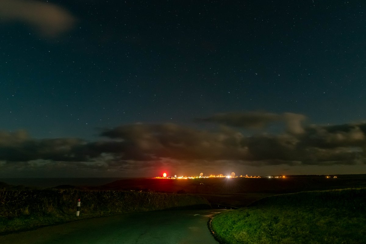 A wide shot of the Bude satellite dish lit up for the 2020 Poppy Appeal