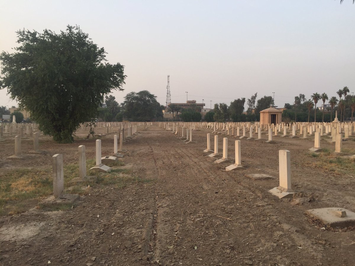 The graveyard has been damaged by multiple bomb blasts that shook the surrounding district of Baghdad throughout the 2000s. Some repairs have been made - note the newer, whiter graves - but the site keeper explained that not all repairs have yet been possible.