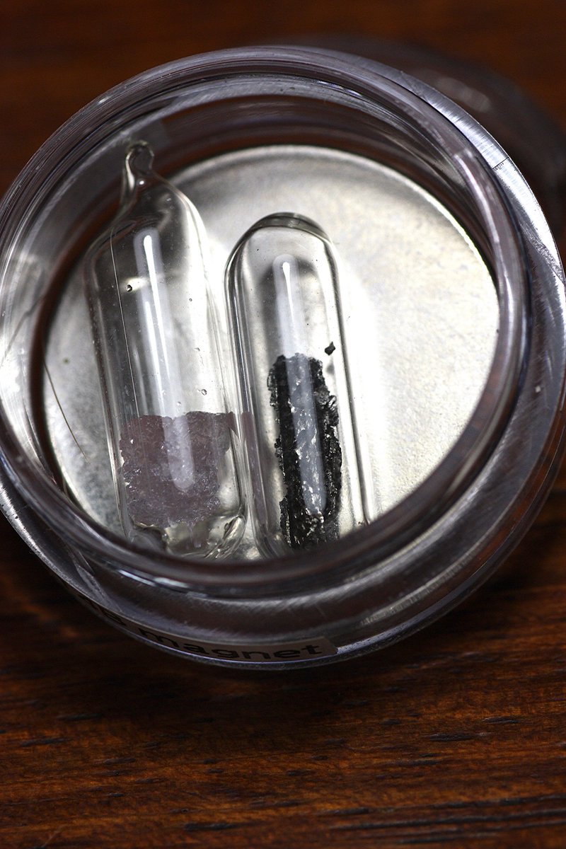 Neodymium  #elementphotos. Metal disc is a "neodymium magnet" (actually Nd2Fe14B), while the pink crystals are neodymium nitrate (Nd(NO3)3.6H2O).