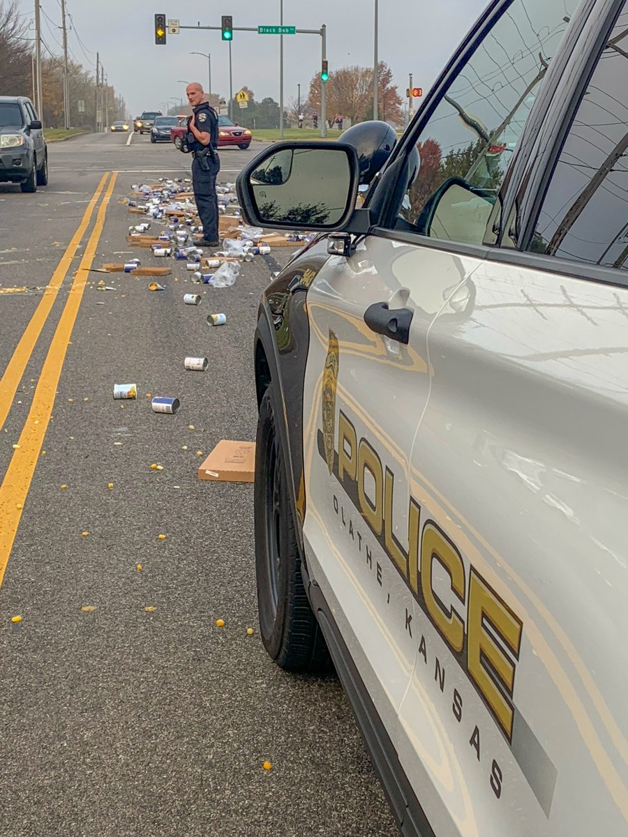OlathePolice's tweet photo. How is your Friday going? Ours is peachy! Great team work by @OlathePolice,  @OlatheFire and @CityofOlatheKS Street Department to get these canned goods cleaned up this morning. https://t.co/U4oTThSO1l