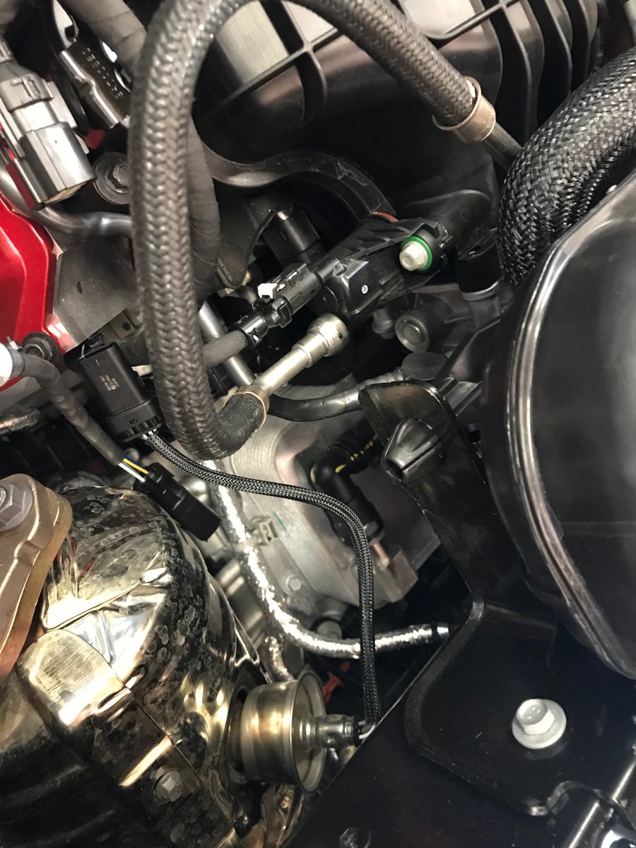 Enlarge the picture and you’ll see a finned box, what I think is the transmission oil cooler.