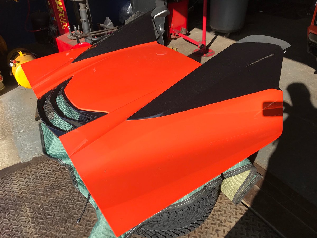 Three bolts on each side to remove the engine cover. When the top is down, it goes between it and the the engine.