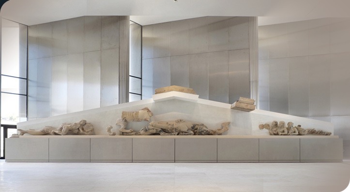 BCRPM's tweet photo. For #MuseumsUnlocked - The Sea and the The Hekatompedon in the Archaic #AcropolisGallery of the #AcropolisMuseum,  the west pediment also depicts Herakles on his right knee, wrestling with the #Triton, a merman with scaly tail of a sea monster. https://t.co/Z2MPKNDuUv https://t.co/wjZTqqLL1S