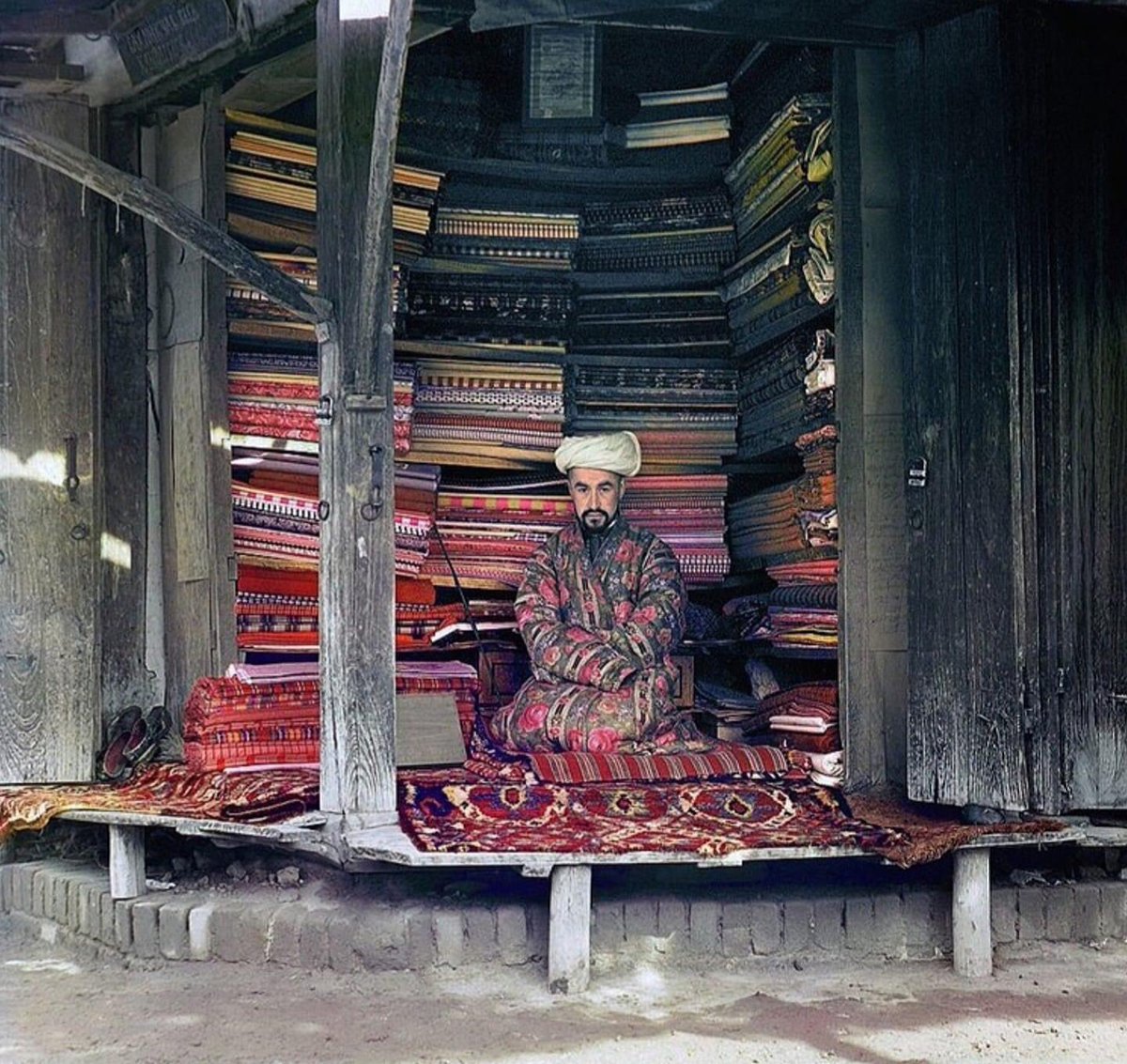 A cloth merchant in Samarkand (present-day Uzbekistan) sits in his stall. Photo taken by Sergei Prokudin-Gorskii circa 1910. A pioneer in the development of color photography.

Via Anartist