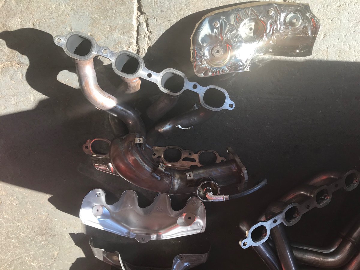 First header out. Five bolts. Pulled up up and out.