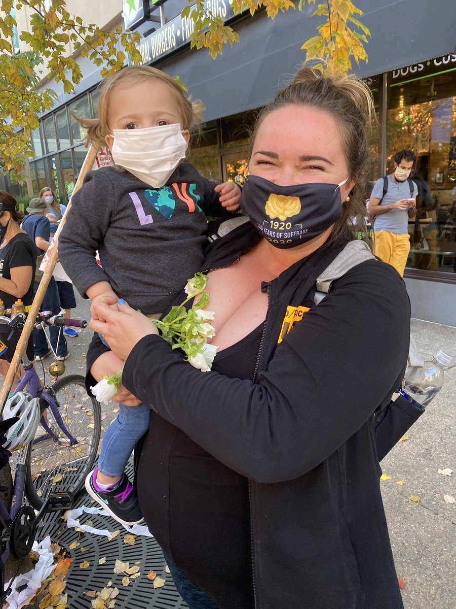 Zoe Fox and her toddler daughter Lili are handing out flowers. “philly is tough,” she told me. “no one fights philly. philly fights back. you wanna mess with us? we’re gonna get the whole city on the streets: toddlers, dogs, flowers, whatever we’ve got: we’re gonna bring it out.”