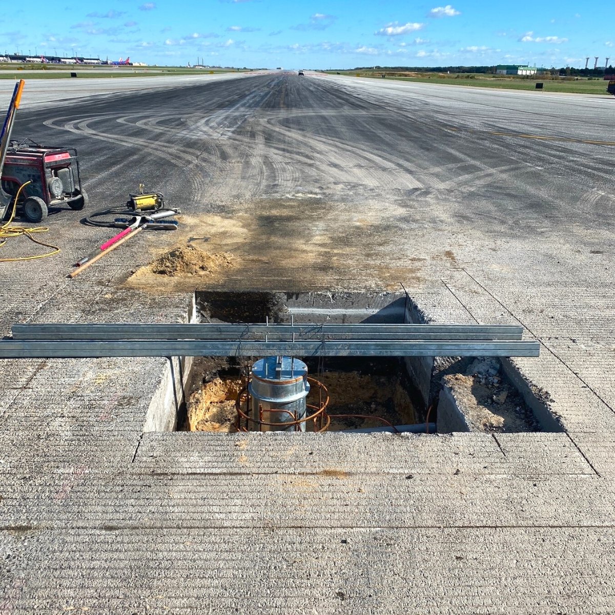Photograph of runway status light (RWSL) repair at BWI Marshall Airport. 