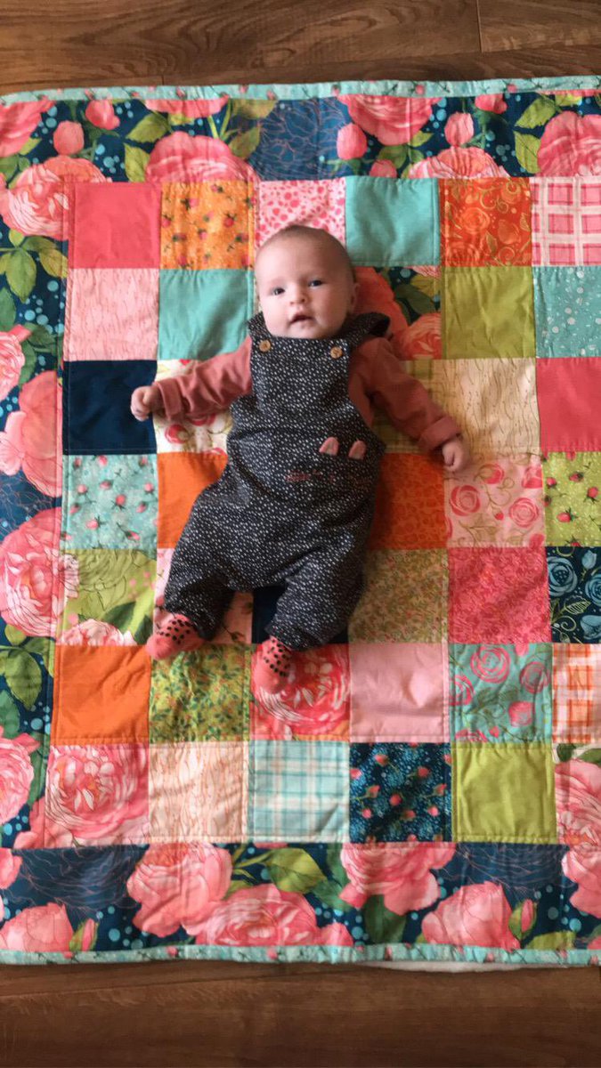 A beautiful baby girl lying out on her new #floral #patchwork #quilt. 

This photo shows perfectly how big the quilt is for the gorgeous model to lie on. 

#modafabrics #RobinPickens #AbbyRose #ShopLocal #ShopInIreland