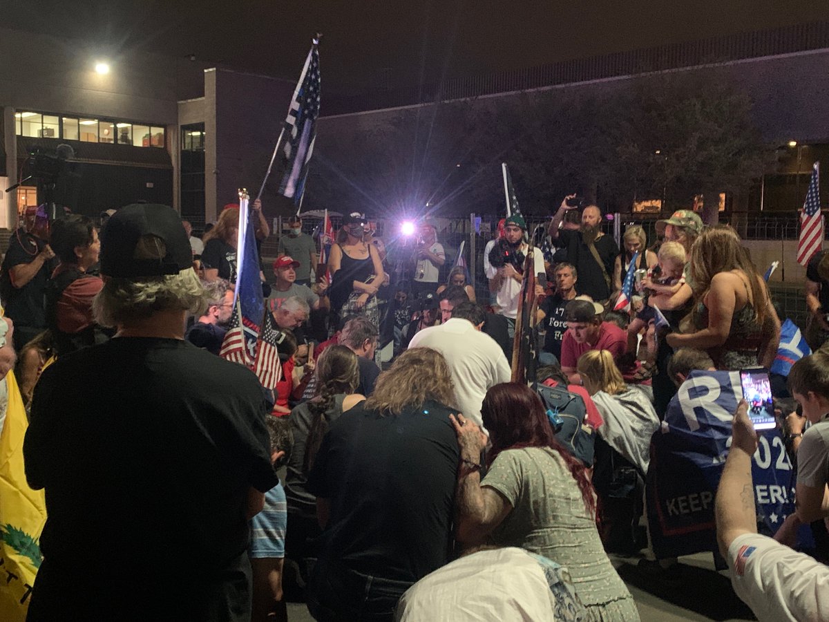 Back. Evening crowd is gathering.