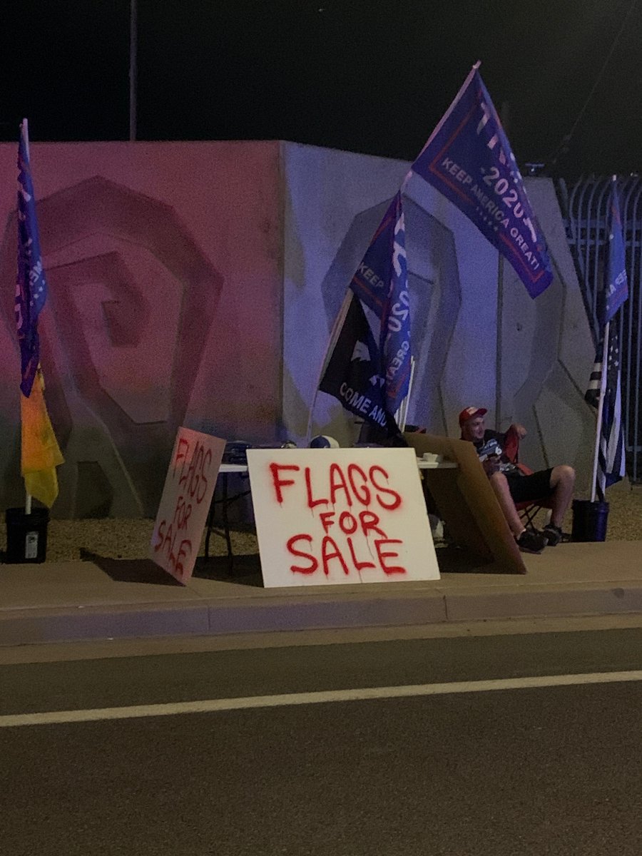 Back. Evening crowd is gathering.