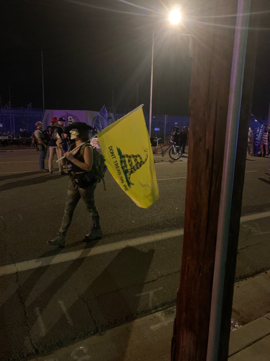 Back. Evening crowd is gathering.