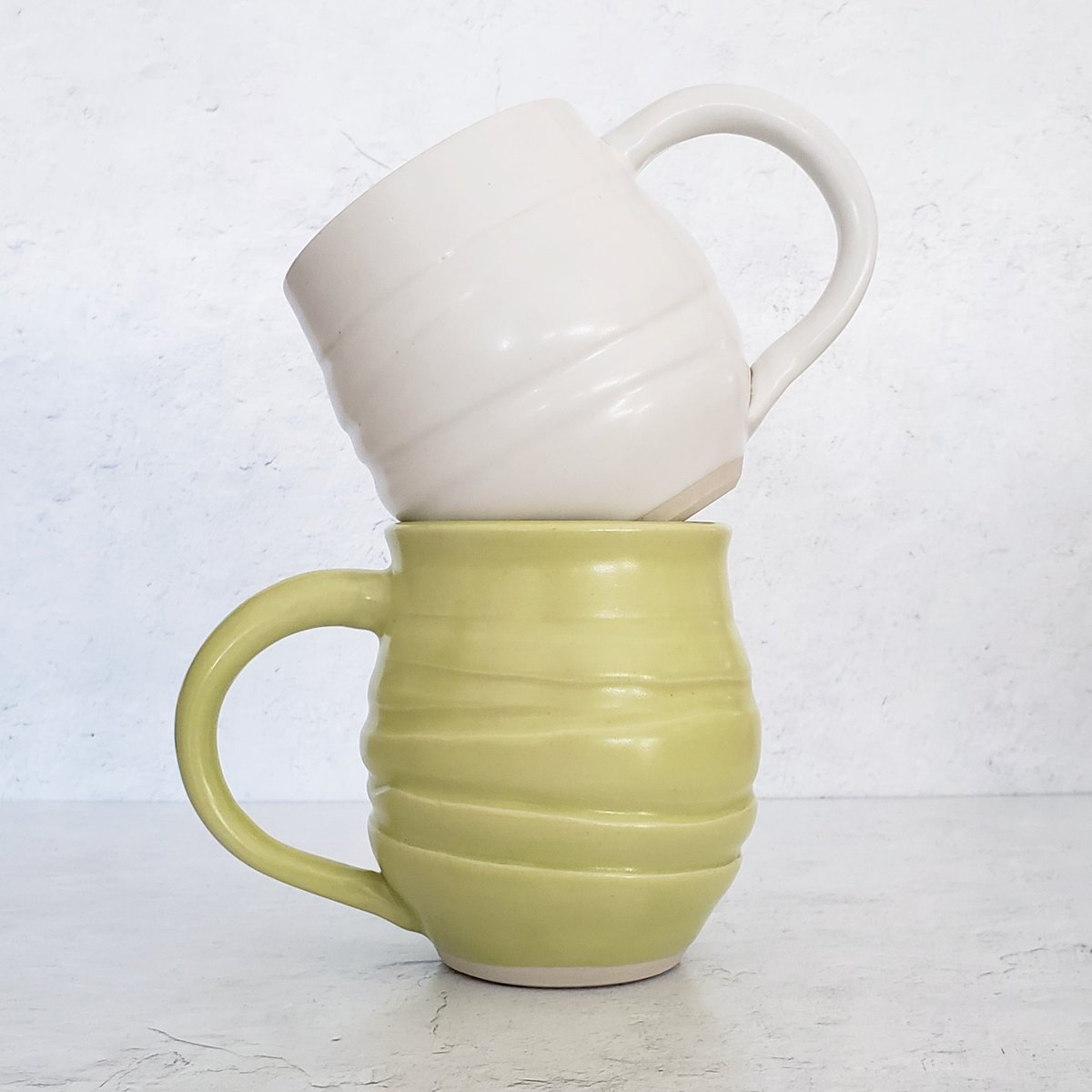 jivepottery's tweet photo. PLS help us name the glaze colors on these galaxy mugs. We have narrowed them down from your suggestions to...

Snow &amp; Tendril
-OR-
Vanilla &amp; Lemon Balm?

We are still open to your suggestions too! #pottery #pottersofinstagram #ceramics #mugs #mugsofinstagram #glaze #porcelain https://t.co/Q0C8VloV8s