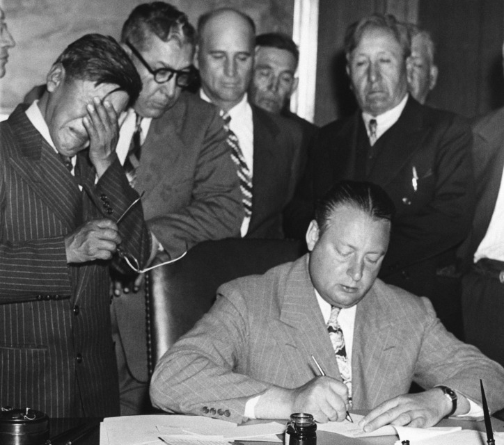I think I posted this when I discussed this history on my streetview journey, but this is a photo that has really stuck with me over the years. We're looking at the signing of the 'agreement' to build these dams; the man at left is the representative of the Fort Berthold Tribes.