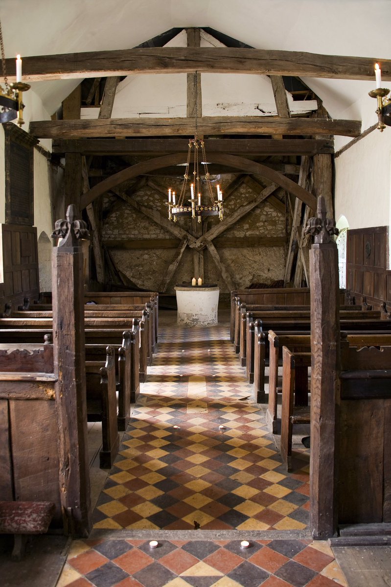 From the 16th-century bell-frame, to the 15th and 18th-century pews, the 19th-century pulpit and panelling, this little church is full of great woodwork. Looking closely at the medieval pews, we can see the carpenter’s marks, but also some scorch marks.2/