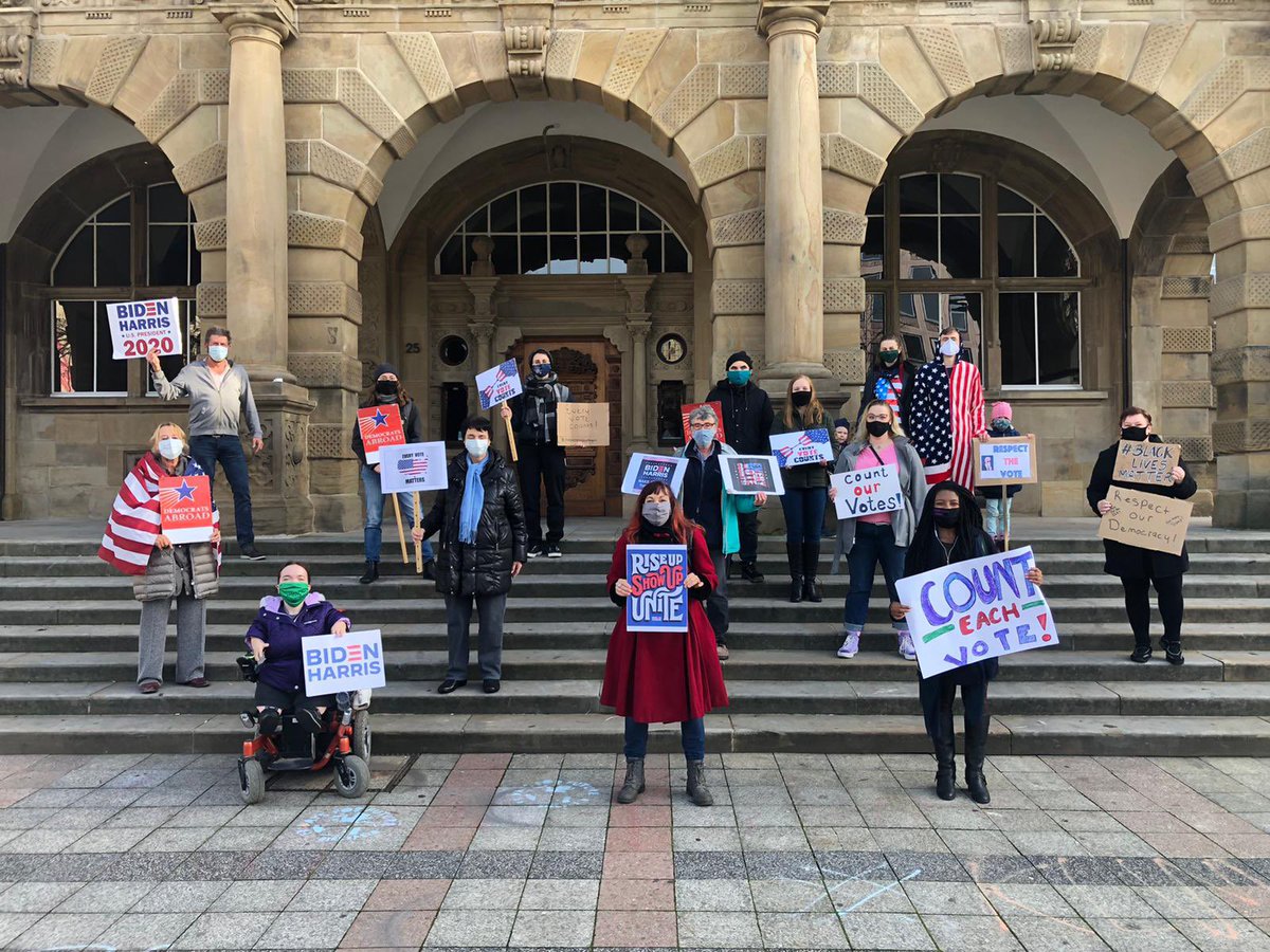 DemsAbroadDE's tweet photo. Our @DemsAbroad members gathered in Bielefeld today for a #CountEveryVote rally. Even came in their American flag onesie! #DAResists #EveryVoteCounts #CountTheVotes https://t.co/Dj4v8DBK30