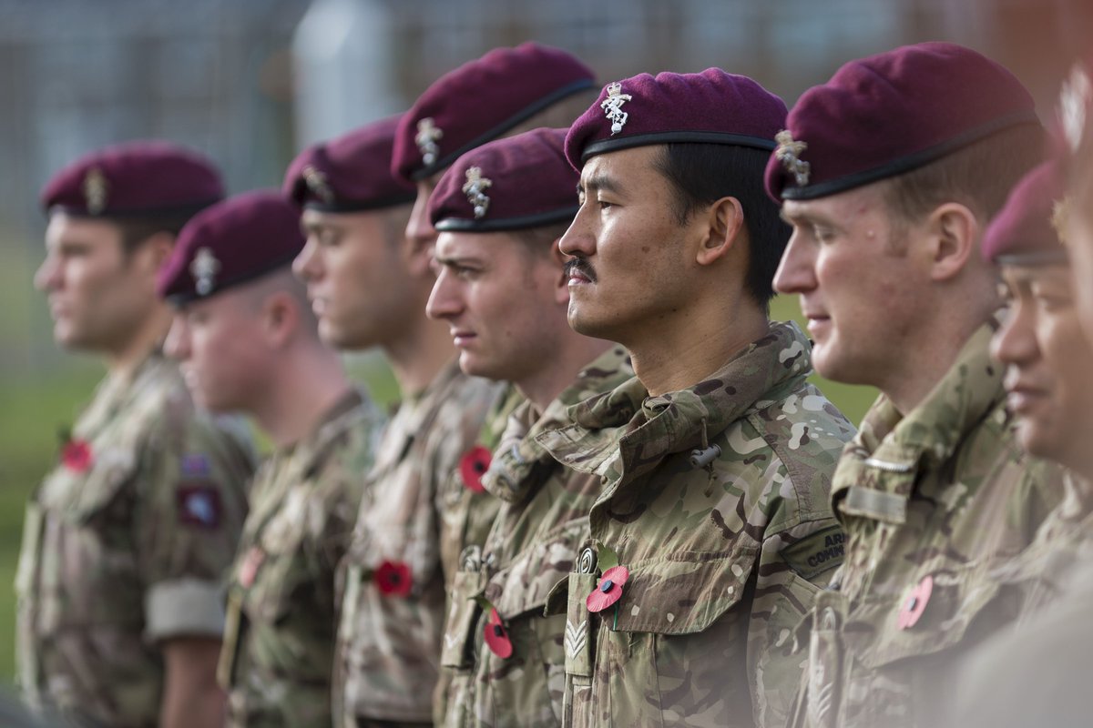 Soldiers wearing Poppies observe the 2 minutes silence.