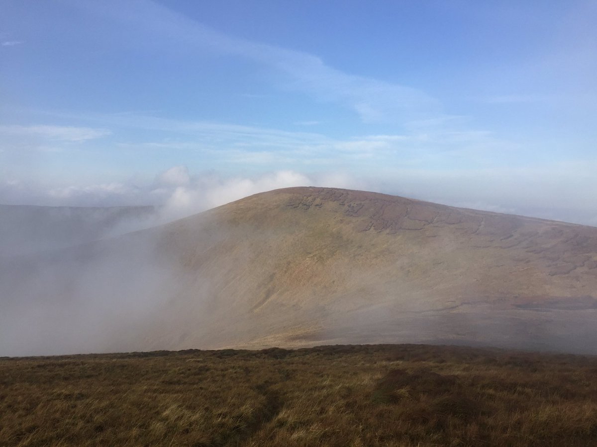 StanCampbell5's tweet photo. Meenard Mountain (620m) emerges from this morning’s fog over the the Sperrins @IrelandWalking https://t.co/0qBOxkMxPh