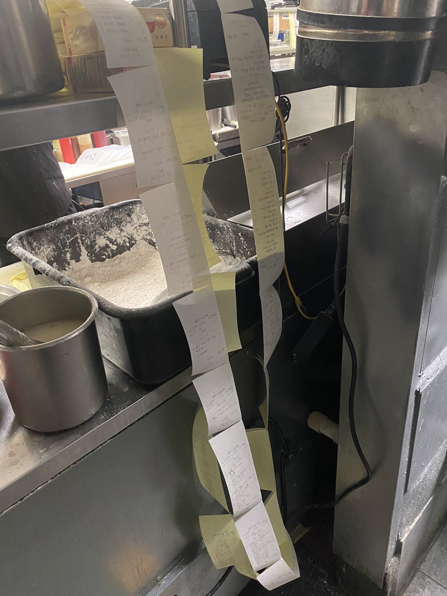 ShitChefsSay's tweet photo. Someone is in the Weeds! This is one printer with two rows of tickets not yet looked at!! 
#thingsonlychefsknow ##howtoannoyyourchef https://t.co/JNnrkEngsv