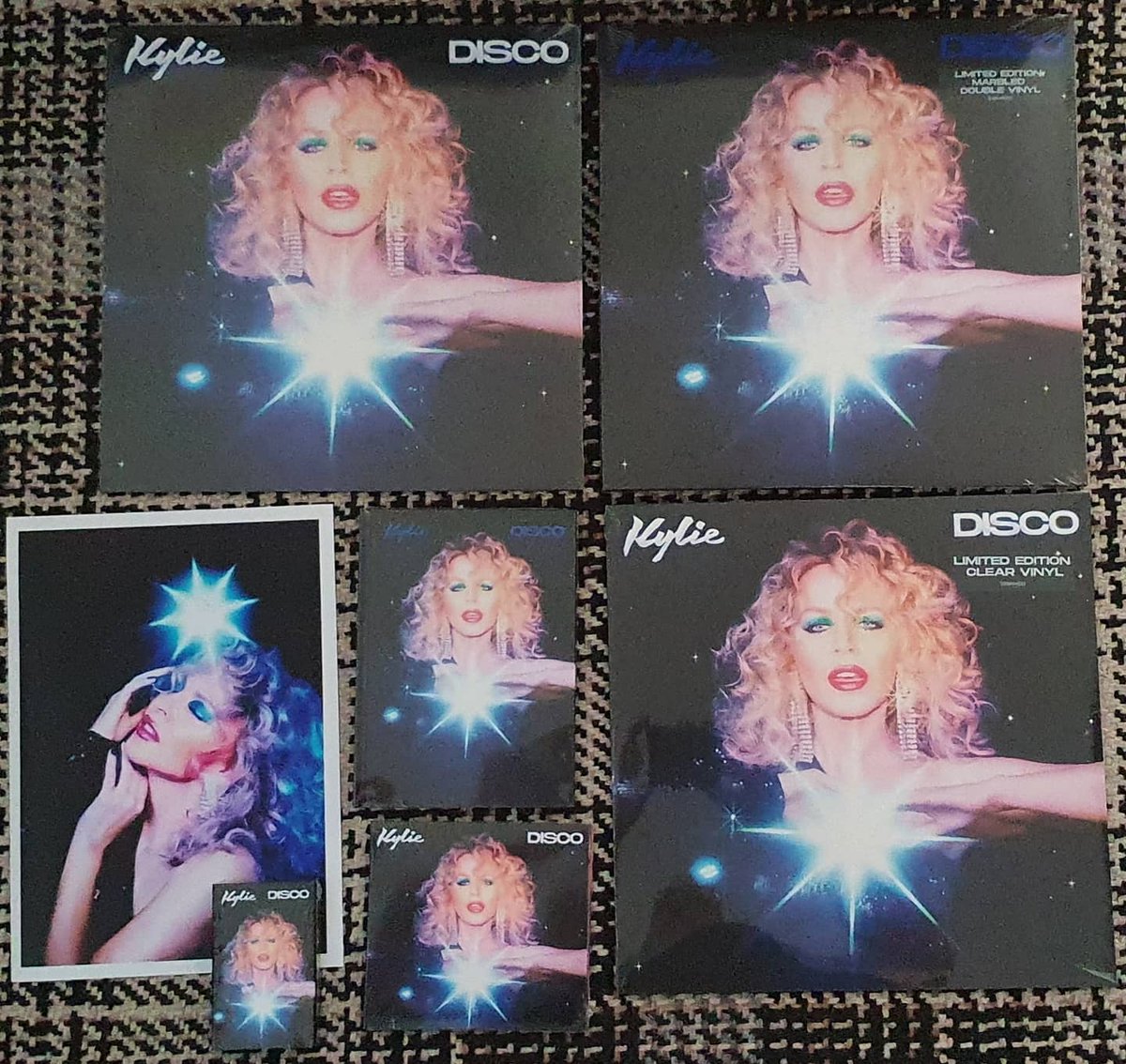 derekcburgess's tweet photo. Today's @kylieminogue #Disco delivery #BlueCassette #BlackVinyl #ClearVinyl #DeluxeMarbledTwoDiscVinyl #DeluxeCD #StandardCD https://t.co/tkrywWs2t4