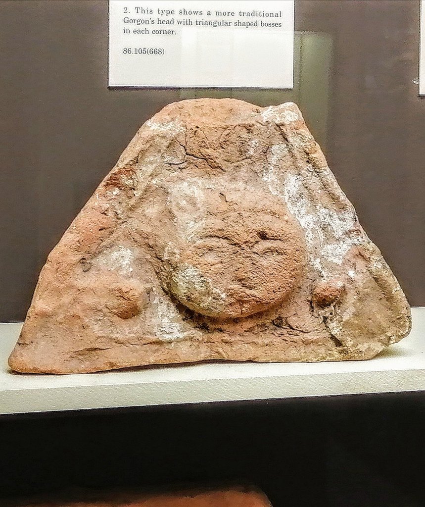 Roman_Britain's tweet photo. It's #cats day for #MuseumsUnlocked! These gorgon antefix tiles are from #Caerleon #Roman fortress in #Wales. They'd have been on the roof looking down at you from the end of a row of imbreces, and ideally warding off evil spirits.. #RomanBritain #RomanArchaeology #Archaeology https://t.co/Qo94dC2XaG