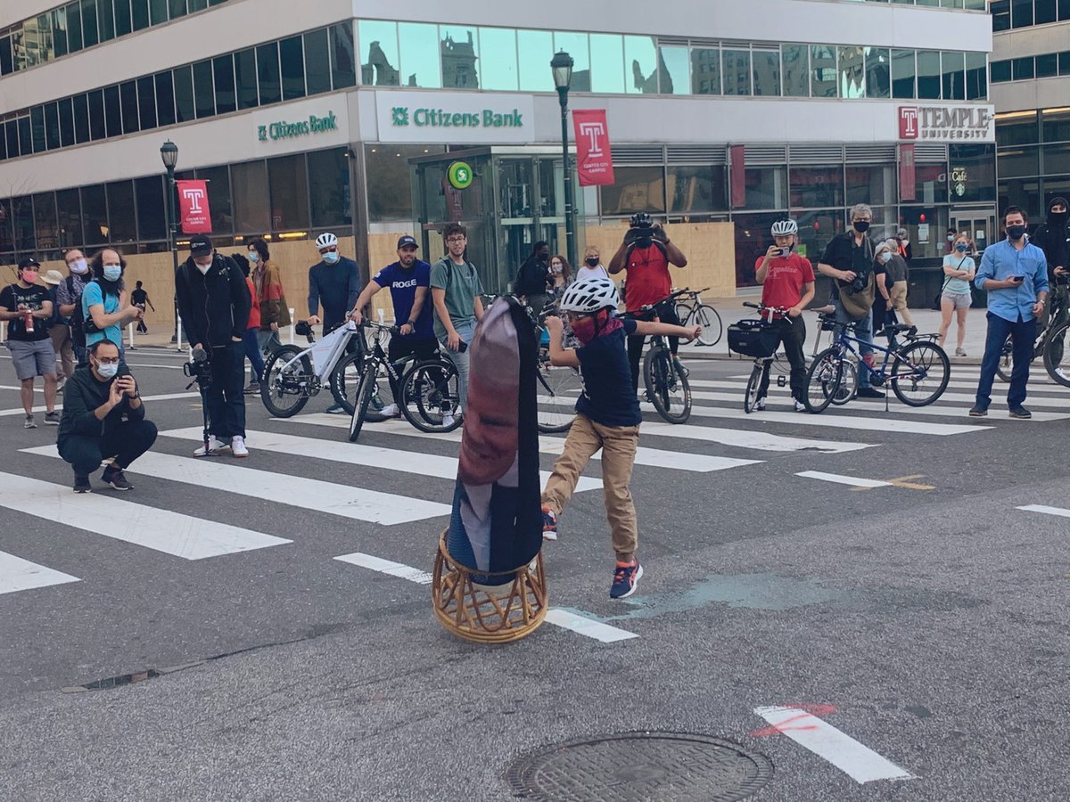 GrimKim's tweet photo. At City Hall in Philly and folks have set up a literal Donald Trump punching bag for people to wail on. This kid MEANT it. https://t.co/ZRvGB2GsLN