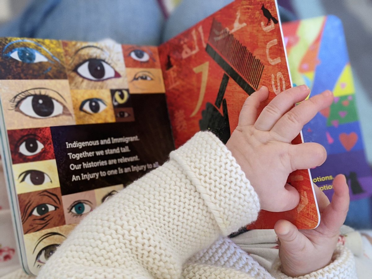 RanyeeChiang's tweet photo. Celebrating this morning's news with a story time lesson for our baby citizen. "Our histories are relevant. An injury to one is an injury to all" #AIsForActivist https://t.co/i8X40PdJfy