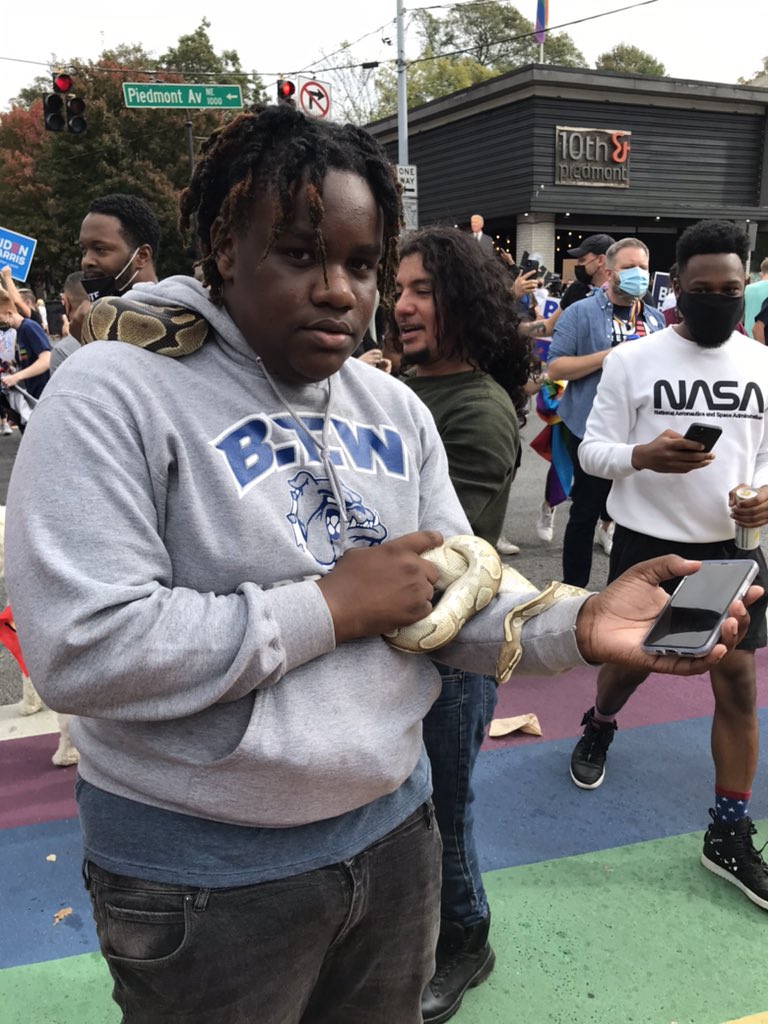 This guy brought his pet snake to party for   #JoeBiden in   #Atlanta   #gapol  @gpbnews