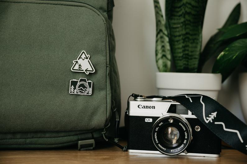 MeganASoreson's tweet photo. @natalinanoel Hey, https://t.co/EgwoBPryHk 
I'm a freelance graphic designer. I do a lot of logo/branding work, as well as product design. I created a business with my husband where I design camera straps, stickers, patches, and pins. https://t.co/Yxo9FdEc8p https://t.co/rtNvGm2li7