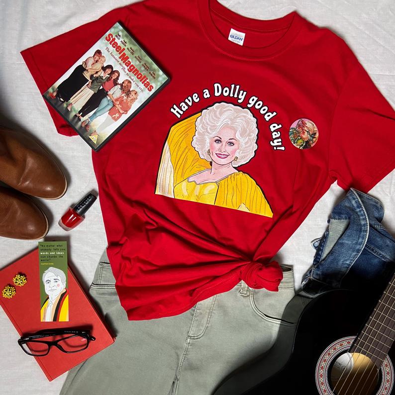 LYDVENT DAY 3: There's only one big-haired blonde I want running America! If you know a fellow fan of Ms. Parton, they'll love finding a Dolly tee under their treeDolly Good Day:  https://tidd.ly/38zaEJd  (AFF)Saint Dolly:  https://tidd.ly/3eBLSsy  (AFF)