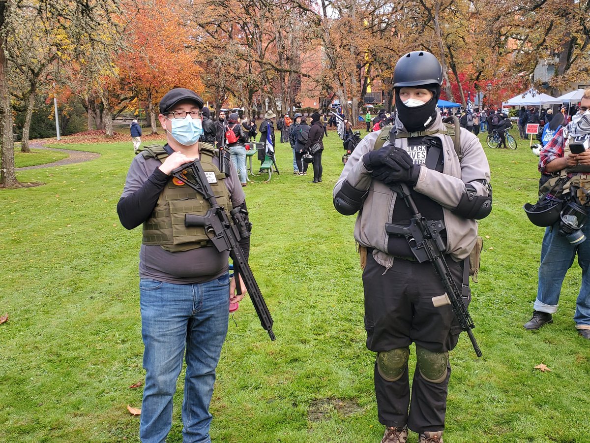 Very nice people with rifles are protecting the gathering.