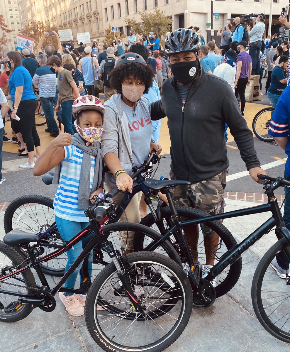 KimDozier's tweet photo. Ryan Segars biked to Black Lives Matter Plaza with his daughters to mark a “historical day,” celebrating that there will be “someone in the executive office who looks like them.” https://t.co/jkacR08RCD