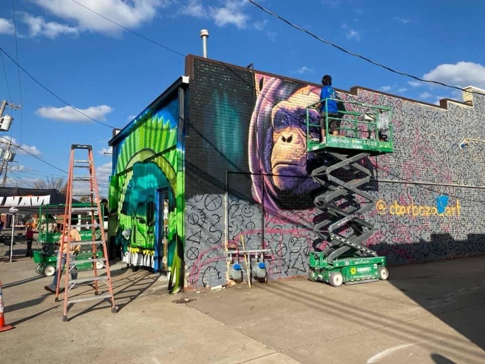 Artists sprucing up our shop walls!!