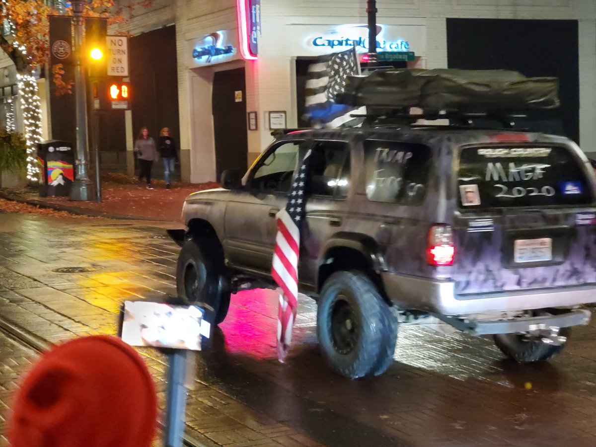 A very Trump-y 4runner drove past the pro Biden celebration at Pioneer Courthouse Square, dragging an American flag in the muck and slime while a Blue Lives Matter flag flaps in the breeze.
