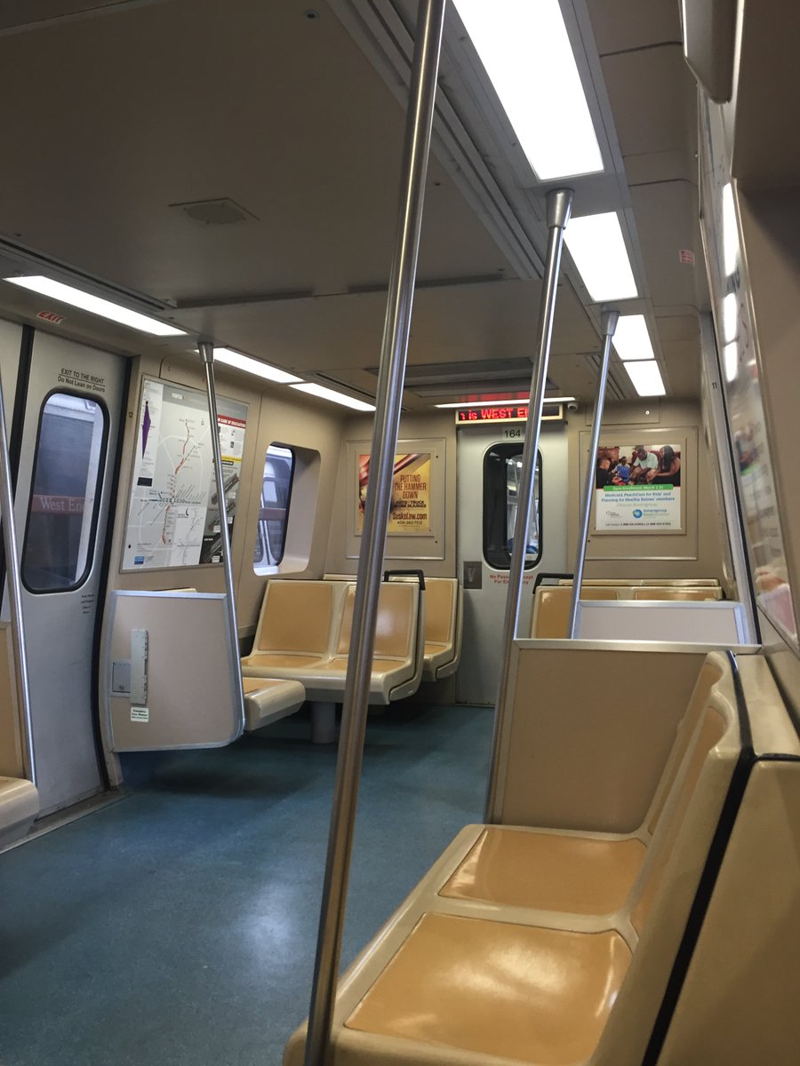 I warned you this would be *every* pic. Slightly diff angle at Woodruff Park; tram tracks; interior of MARTA train to the airport. Last pic taken the previous day: railway through Athens, seen from Oconee St. Streetview suggests the wagons in the distance haven't moved in years.